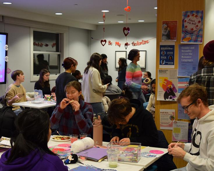 People seated and standing mingling with each other.
